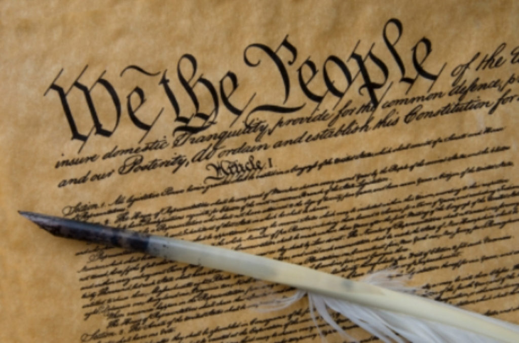 Quill pen on Preamble to the United States Constitution document
