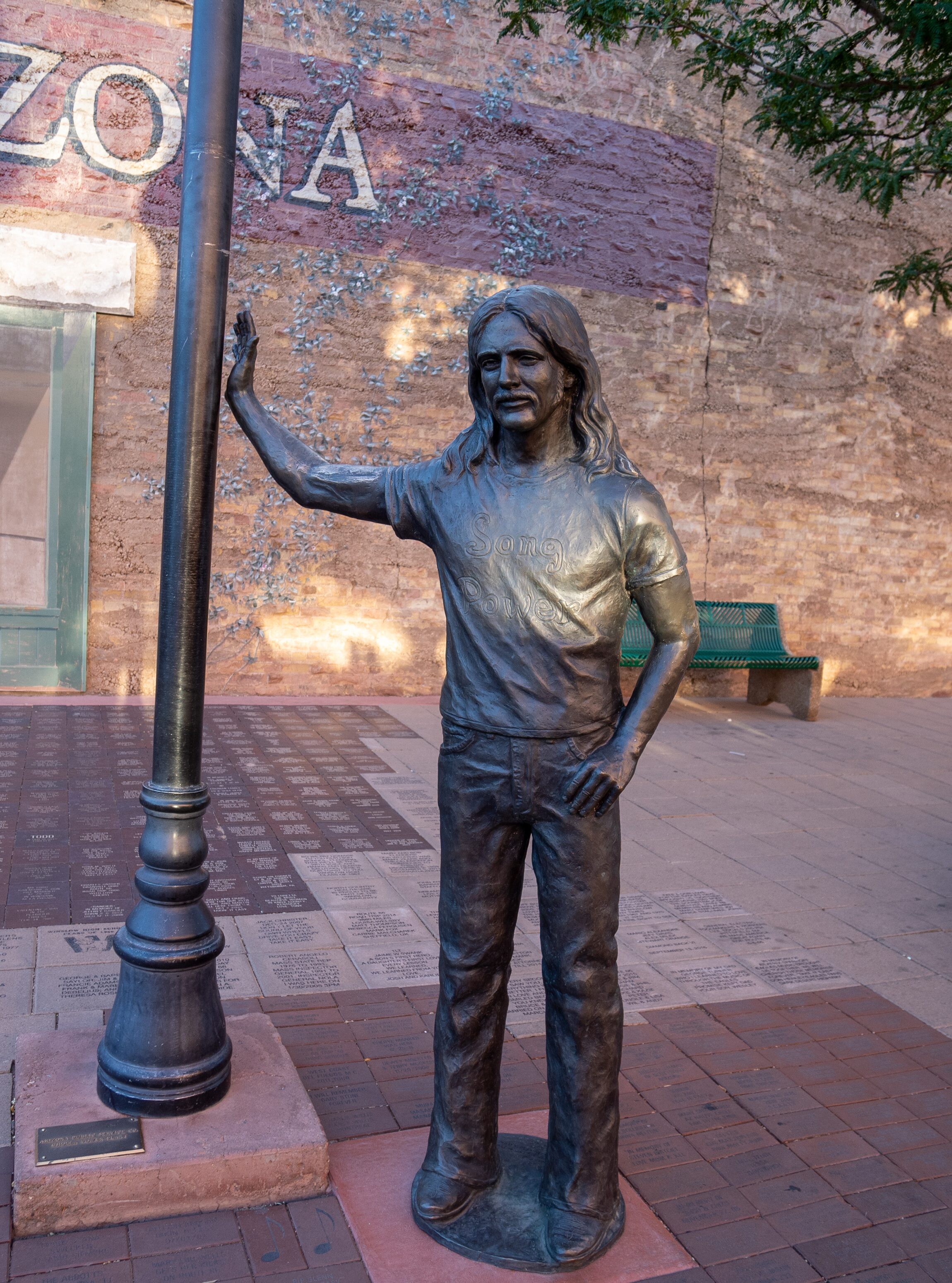 WINSLOW, AZ: Statue of Glenn Frey from The Eagles - Standin On The Corner in Winslow Arizona along Route 66 Graphic